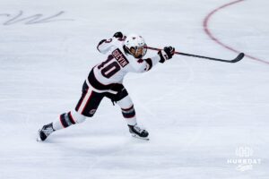 Omaha Maverick Jacob Guevin takes a shot during a hockey match against the UMass Minutemen at Baxter Arena on October 24th, 2025, in Omaha, Nebraska. Photo by Collin Stilen.