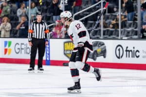 Omaha Maverick Luke Woodworth celebrates his goal during a hockey match against the UMass Minutemen at Baxter Arena on October 24th, 2025, in Omaha, Nebraska. Photo by Collin Stilen.