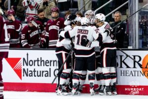 Omaha Mavericks celebrate a goal during a hockey match against the UMass Minutemen at Baxter Arena on October 24th, 2025, in Omaha, Nebraska. Photo by Collin Stilen.