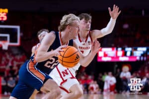Midland Viking guard Jake Orr (22) drives to the basket against Nebraska Cornhusker Connor Essegian (0) in the first half during a college men’s basketball exhibition game on Monday, October 27, 2025, in Lincoln, Nebraska. Photo by John S. Peterson.