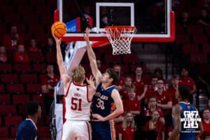 Nebraska Cornhusker Rienk Mast (51) makes a lay up against Midland Viking forward Cole Petersen (30) in the first half during a college men’s basketball exhibition game on Monday, October 27, 2025, in Lincoln, Nebraska. Photo by John S. Peterson.