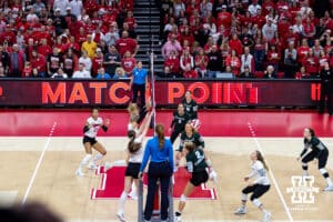 Nebraska Cornhusker setter Bergen Reilly (2) blocks a spike for match point against the Michigan State Spartans in the third set during a college volleyball match on Saturday, October 25, 2025, in Lincoln, Nebraska. Photo by John S. Peterson.