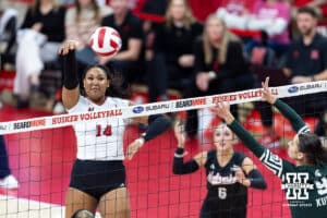 Nebraska Cornhusker middle blocker Manaia Ogbechie (14) spikes the ball against Michigan State Spartan middle blocker Zuzanna Kulig (9) in the third set during a college volleyball match on Saturday, October 25, 2025, in Lincoln, Nebraska. Photo by John S. Peterson.