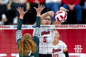 Nebraska Cornhusker middle blocker Rebekah Allick (5) dumps the ball against Michigan State Spartan setter Malayah Long (7) in the second set during a college volleyball match on Saturday, October 25, 2025, in Lincoln, Nebraska. Photo by John S. Peterson.
