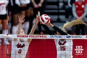 Nebraska Cornhusker middle blocker Andi Jackson (15) and setter Bergen Reilly (2) block the ball State Spartans in the second set during a college volleyball match on Saturday, October 25, 2025, in Lincoln, Nebraska. Photo by John S. Peterson.