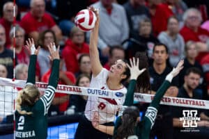 Nebraska Cornhusker opposite Virginia Adriano (9) spikes the ball against Michigan State Spartan outside hitter Karolina Staniszewska (2) and middle blocker Carmen Waye (22) in the second set during a college volleyball match on Saturday, October 25, 2025, in Lincoln, Nebraska. Photo by John S. Peterson.