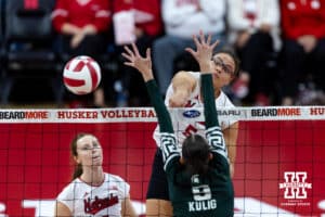 Nebraska Cornhusker middle blocker Rebekah Allick (5) spikes the ball against Michigan State Spartan middle blocker Zuzanna Kulig (9) in the first set during a college volleyball match on Saturday, October 25, 2025, in Lincoln, Nebraska. Photo by John S. Peterson.
