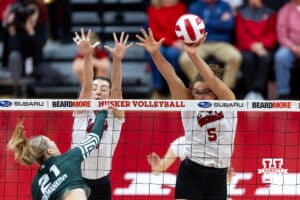 Nebraska Cornhusker middle blocker Rebekah Allick (5) blocks the ball against Michigan State Spartan opposite Caroline Formankova (21) in the first set during a college volleyball match on Saturday, October 25, 2025, in Lincoln, Nebraska. Photo by John S. Peterson.