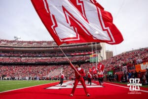 Nebraska Cornhusker Cheer Squad waving the N flag celebrating a touchdown during a college football game against the Northwestern Wildcats on Saturday, October 25, 2025, in Lincoln, Nebraska. Photo by John S. Peterson.