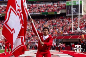 Nebraska Cornhusker Cheer Squad waving the N flag celebrating a touchdown during a college football game against the Northwestern Wildcats on Saturday, October 25, 2025, in Lincoln, Nebraska. Photo by John S. Peterson.