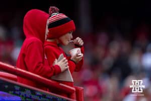 Nebraska Cornhusker fans enjoying a snack during a college football game against the Northwestern Wildcats on Saturday, October 25, 2025, in Lincoln, Nebraska. Photo by John S. Peterson.