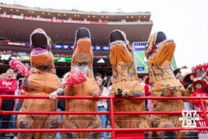 Nebraska Cornhusker student fans dressed up as T-Rex during a college football game against the Northwestern Wildcats on Saturday, October 25, 2025, in Lincoln, Nebraska. Photo by John S. Peterson.