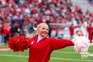 Nebraska Cornhuskers Cheer Squad member performing before a college football game against the Northwestern Wildcats on Saturday, October 25, 2025, in Lincoln, Nebraska. Photo by John S. Peterson.