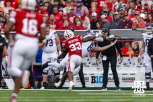 Northwestern Wildcat tight end Hunter Welcing (84) makes a catch against Nebraska Cornhusker linebacker Marques Watson-Trent (33) in the fourth quarter during a college football game on Saturday, October 25, 2025, in Lincoln, Nebraska. Photo by John S. Peterson.
