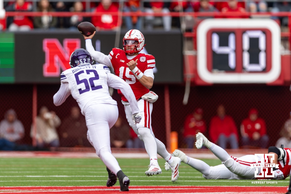 Nebraska Cornhusker quarterback Dylan Raiola (15) throws a pass against Northwestern Wildcat defensive lineman Richie Hagarty (52) to wide receiver Nyziah Hunter for a first down in the fourth quarter during a college football game on Saturday, October 25, 2025, in Lincoln, Nebraska. Photo by John S. Peterson.