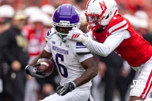 Nebraska Cornhusker defensive back Ceyair Wright (1) tackles Northwestern Wildcat running back Joseph Himon II (6) and gets a penlty for the face mask in the third quarter during a college football game on Saturday, October 25, 2025, in Lincoln, Nebraska. Photo by John S. Peterson.