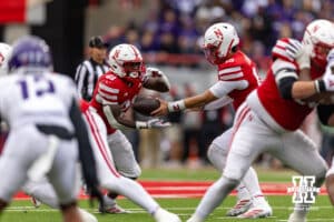 Nebraska Cornhusker quarterback Dylan Raiola (15) hands the ball off to running back Emmett Johnson (21) in the third quarter against the Northwestern Wildcats during a college football game on Saturday, October 25, 2025, in Lincoln, Nebraska. Photo by John S. Peterson.