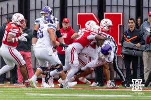 Nebraska Cornhusker defensive back Marques Buford Jr. (3) and defensive back Donovan Jones (37) tackle Northwestern Wildcat running back Joseph Himon II (6) during a college football game on Saturday, October 25, 2025, in Lincoln, Nebraska. Photo by John S. Peterson.