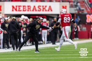 Nebraska Cornhuskers special team coordinator Mike Ekeler gives five to Nebraska Cornhusker offensive lineman Turner Corcoran (89) during a college football game on Saturday, October 25, 2025, in Lincoln, Nebraska. Photo by John S. Peterson.