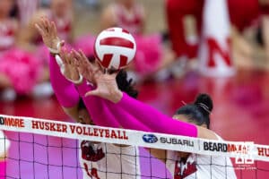 Nebraska Cornhusker middle blocker Manaia Ogbechie (14) and outside hitter Teraya Sigler (11) block the ball against the Northwestern Wildcats in the third set during a college volleyball match on Friday, October 24, 2025, in Lincoln, Nebraska. Photo by John S. Peterson.