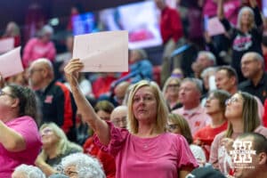 Nebraska Cornhuskers fans holding sign standing for someone they know effected by cancer during a college volleyball match against the Northwestern Wildcats on Friday, October 24, 2025, in Lincoln, Nebraska. Photo by John S. Peterson.