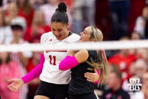 Nebraska Cornhusker outside hitter Teraya Sigler (11) and libero Laney Choboy (6) hug celebrating a point against the Northwestern Wildcats in the second set during a college volleyball match on Friday, October 24, 2025, in Lincoln, Nebraska. Photo by John S. Peterson.