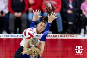 Nebraska Cornhusker outside hitter Harper Murray (27) spikes the ball against Northwestern Wildcat middle blocker Kayla Kauffman (4) in the second set during a college volleyball match on Friday, October 24, 2025, in Lincoln, Nebraska. Photo by John S. Peterson.
