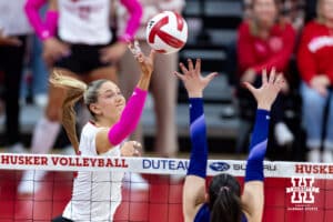 Nebraska Cornhusker middle blocker Andi Jackson (15) tips the ball over Northwestern Wildcat outside hitter Buse Hazan (12) in the second set during a college volleyball match on Friday, October 24, 2025, in Lincoln, Nebraska. Photo by John S. Peterson.