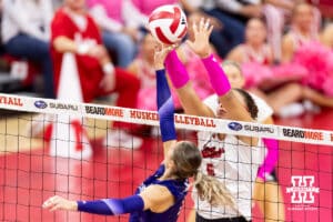 Nebraska Cornhusker middle blocker Rebekah Allick (5) reaches to block Northwestern Wildcat outside hitter Buse Hazan (12) in the first set during a college volleyball match on Friday, October 24, 2025, in Lincoln, Nebraska. Photo by John S. Peterson.