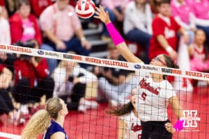 Nebraska Cornhusker middle blocker Rebekah Allick (5) reaches for the ball against Northwestern Wildcat middle blocker Gabrielle Gerry (8) in the first set during a college volleyball match on Friday, October 24, 2025, in Lincoln, Nebraska. Photo by John S. Peterson.