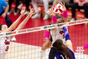 Nebraska Cornhusker middle blocker Rebekah Allick (5) blocks a spike from Northwestern Wildcat outside hitter Buse Hazan (12) in the first set during a college volleyball match on Friday, October 24, 2025, in Lincoln, Nebraska. Photo by John S. Peterson.
