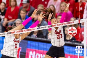 Nebraska Cornhusker outside hitter Harper Murray (27) and Nebraska Cornhusker middle blocker Rebekah Allick (5) block the ball against the Northwestern Wildcats in the first set during a college volleyball match on Friday, October 24, 2025, in Lincoln, Nebraska. Photo by John S. Peterson.