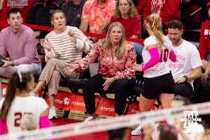 Nebraska Cornhusker head coach Dani Busboom Kelly gives defensive specialist Olivia Mauch (10) five during a college volleyball match against the Northwestern Wildcats on Friday, October 24, 2025, in Lincoln, Nebraska. Photo by John S. Peterson.