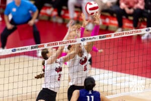 Nebraska Cornhusker setter Bergen Reilly (2) and middle blocker Rebekah Allick (5) go for the block against Northwestern Wildcat outside hitter Ayah Elnady (11) in the first set during a college volleyball match on Friday, October 24, 2025, in Lincoln, Nebraska. Photo by John S. Peterson.