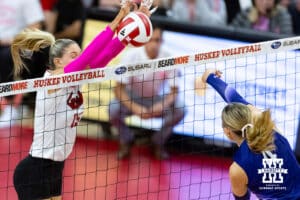 Nebraska Cornhusker middle blocker Andi Jackson (15) blocks a spike from Northwestern Wildcat middle blocker Kayla Kauffman (4) in the first set during a college volleyball match on Friday, October 24, 2025, in Lincoln, Nebraska. Photo by John S. Peterson.