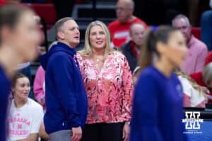 Nebraska Cornhusker head coach Dani Busboom Kelly and Northwestern Wildcat head coach Tim Nollan talk before a college volleyball match on Friday, October 24, 2025, in Lincoln, Nebraska. Photo by John S. Peterson.
