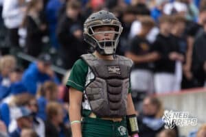 A Central City Catcher looks foir the signalk from her coach during a high school softball game, Monday, October 20, 2025, Lincoln, Nebraska. Photo by Braden Cochran.