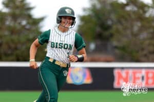 Central City Bison Juno Ryan (3) flashes a smile while rounding thrid base after a hoemrun to take the leadduring a high school softball game, Monday, October 20, 2025, Lincoln, Nebraska. Photo by Braden Cochran.