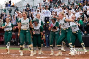 The Central City softball team celebrates after a homerun by Juno Ryan (3) during a high school softball game, Monday, October 20, 2025, Lincoln, Nebraska. Photo by Braden Cochran.