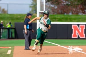 Central City third baseman Payton Burbach (11) rounds third base towards home plate during a high school softball game, Monday, October 20, 2025, Lincoln, Nebraska. Photo by Braden Cochran.