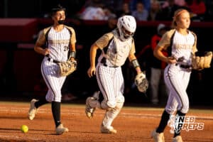 Northwest infielder Laiken Dorsey (26) runs back to the dugout with teammates after the final out of an inning during a high school softball championship game, Monday, October 20, 2025, Lincoln, Nebraska. Photo by Braden Cochran.