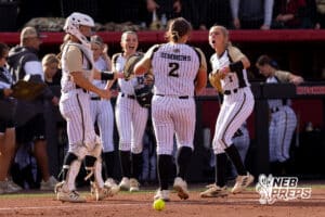 The Northwest dugout welcomes back pitcher Graclyn Simmons (2) after a strike out during a high school softball championship game, Monday, October 20, 2025, Lincoln, Nebraska. Photo by Braden Cochran.