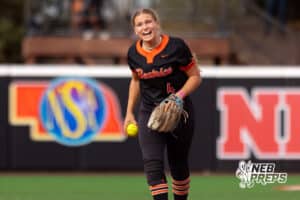 Beatrice defenseman Callie Schwisow (4) celebrates after catching a ball to get a base runner out during a high school softball championship game, Saturday, October 20, 2025, Lincoln, Nebraska. Photo by Braden Cochran.