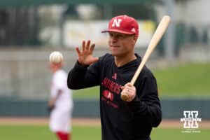 Nebraska assistant coach Mike Sirianni is hitting balls for players to field during the red/white scrimmage on Tuesday, October 14th, 2025, in Lincoln, Nebraska. Photo by Braden Cochran.