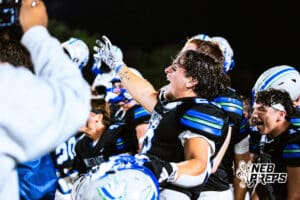 Millard North's James Browne (23) is celebrating a big win with teammates after a high school football game against Omaha Central on Friday, October 17, 2025, in Omaha, Nebraska. Photo By Jack Stephens.