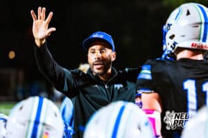 Millard North's Head Coach Allen Burrell talks to his team in a huddle after a big win in a high school football game against Omaha Central on Friday, October 17, 2025, in Omaha, Nebraska. Photo By Jack Stephens.
