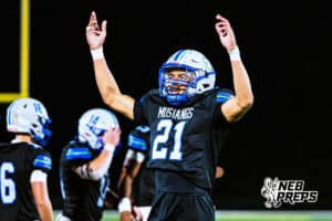Millard North's Christian Boles (21) is hyping up the crowd after securing a big win during a high school football game against Omaha Central on Friday, October 17, 2025, in Omaha, Nebraska. Photo By Jack Stephens.