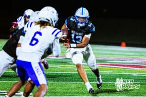 Millard North's Zion Rush (13) rushing the ball for a first down during a high school football game against Omaha Central on Friday, October 17, 2025, in Omaha, Nebraska. Photo By Jack Stephens.