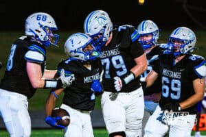 Millard North's Isaiah Traylor (1) is celebrating with teammates after running it in for a touchdown during a high school football game VS Omaha Central on Friday, October 17, 2025, in Omaha, Nebraska. Photo By Jack Stephens.