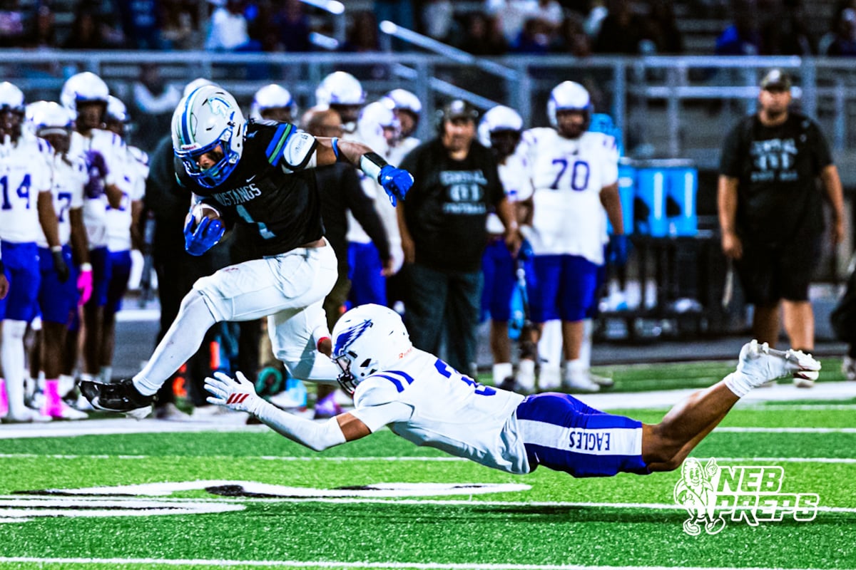 Millard North's Isaiah Traylor (1) evades defenders' tackle for a significant gain and a touchdown during a high school football game VS Omaha Central on Friday, October 17, 2025, in Omaha, Nebraska. Photo By Jack Stephens.